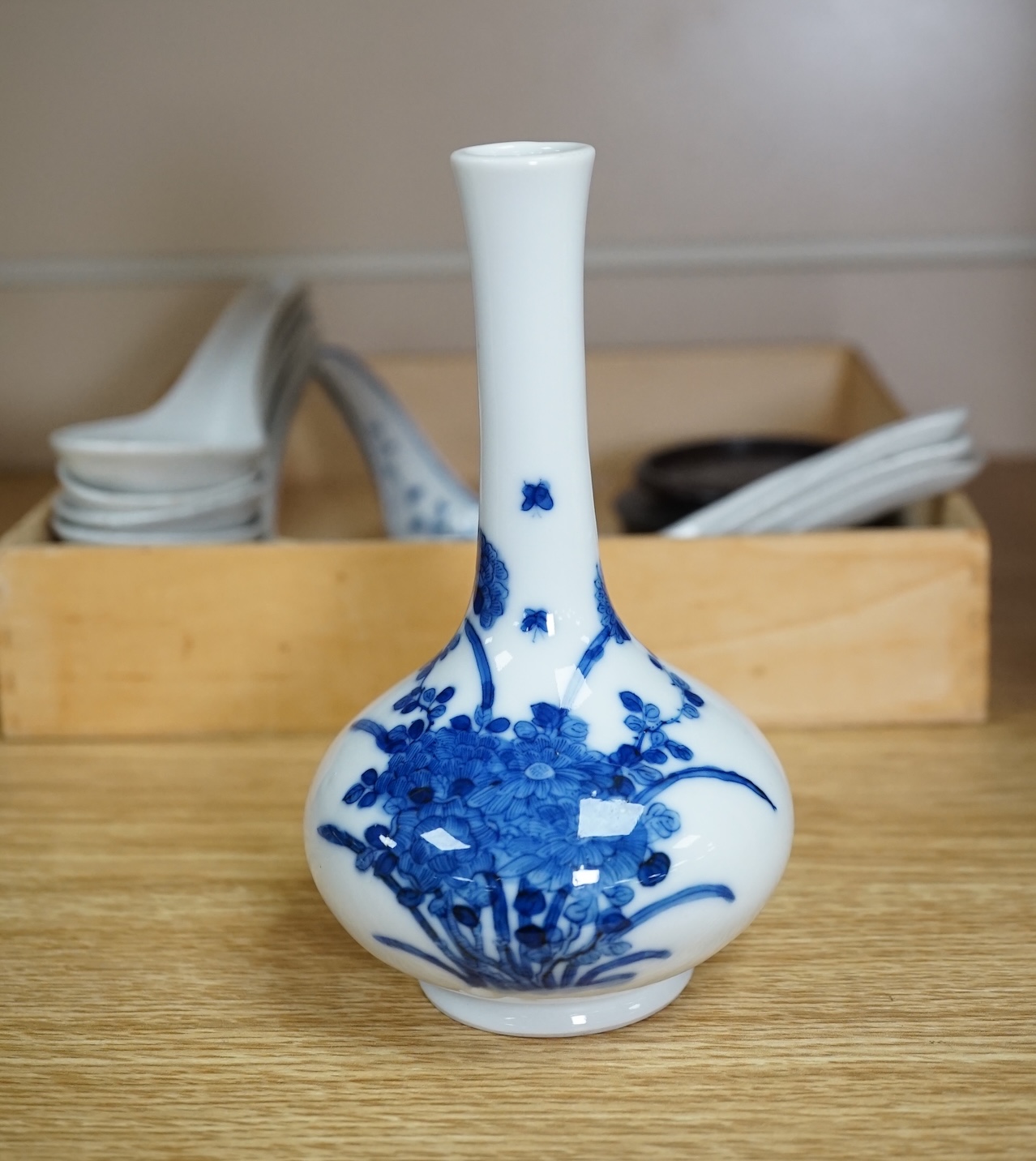 A small Chinese porcelain blue and white vase, Republic period, on a hardwood stand and various soup spoons, Guangxu/Republic period, vase 14cm high. Condition - good